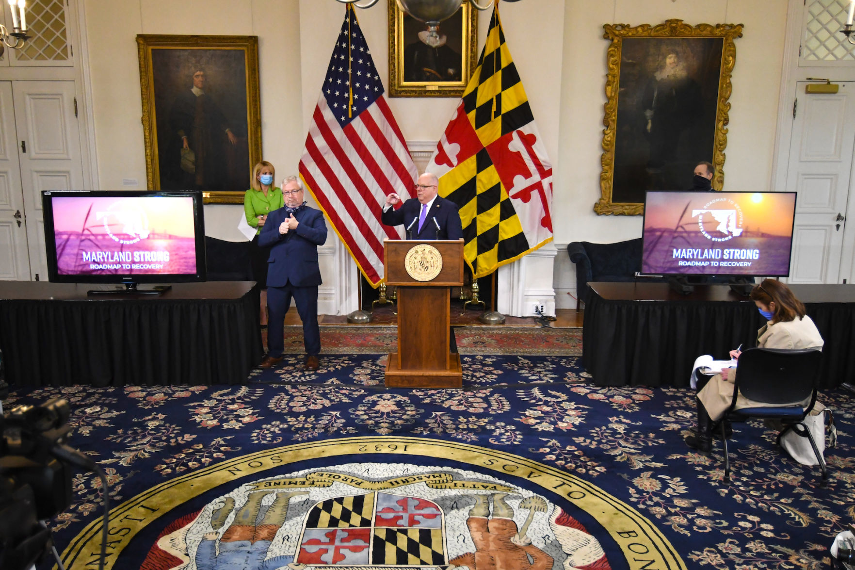 Reopen rally shows rift between Harris, Hogan